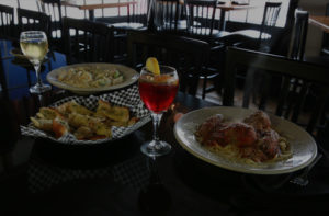 Nikolas Pizza, pasta, meatballs, sausage, spaghetti, garlic bread, wine